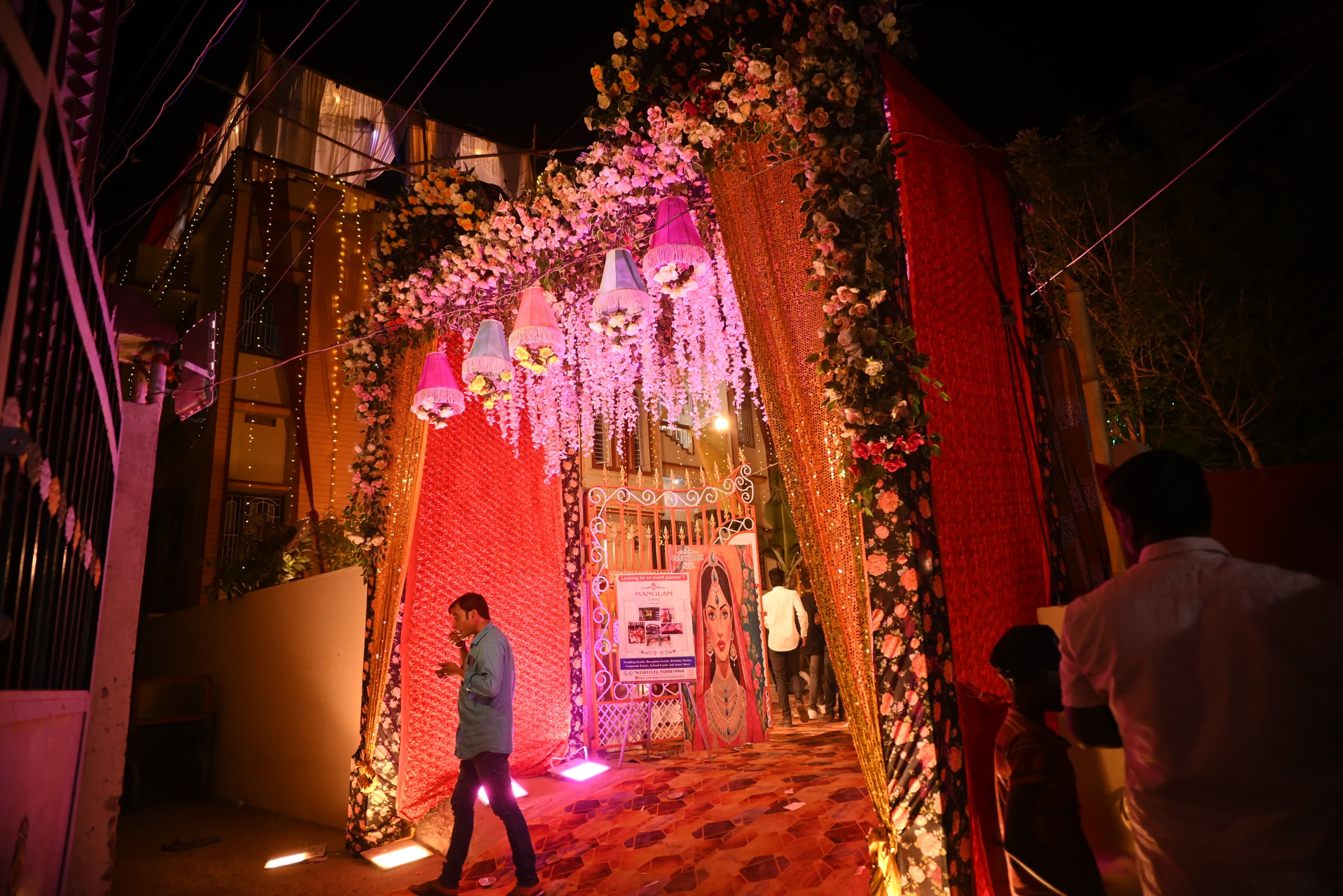 A Manglam Event celebration entrance glowing at night